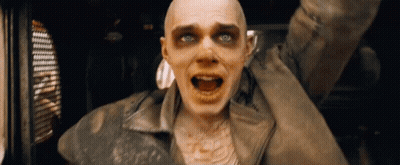 A Man With A Dirty Face And A Dirty Jacket Is Screaming GIF