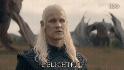 A Man With A Dragon In The Background Says " Delightful " GIF