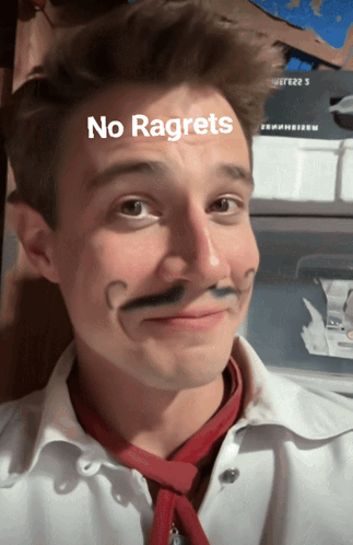 A Man With A Fake Mustache Has The Words No Regrets Written On His Face GIF