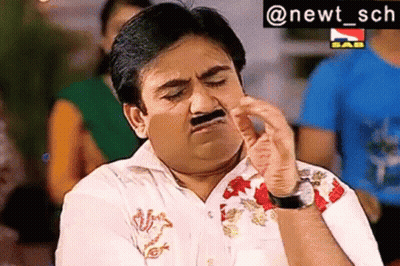 A Man With A Fake Mustache Is Making A Funny Face With His Hand . GIF