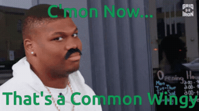 A Man With A Fake Mustache Is Standing In Front Of A Sign That Says " C'mon Now " GIF
