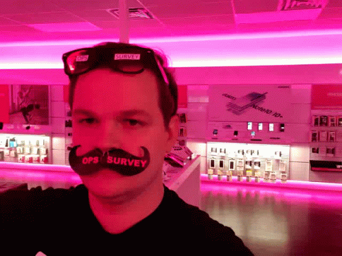 A Man With A Fake Mustache That Says Ops Survey On It GIF