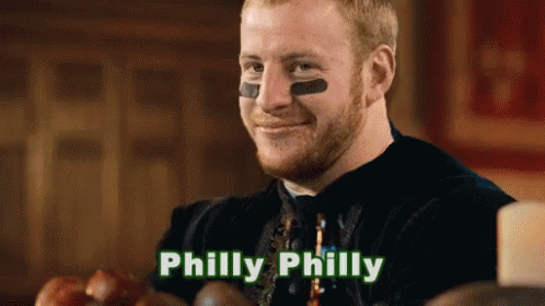 A Man With A Football On His Face And The Word Philly On The Bottom GIF