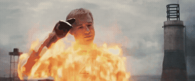 A Man With A Glove On His Head Is On Fire GIF