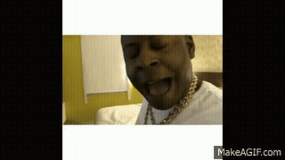 A Man With A Gold Chain Around His Neck Is Making A Face GIF
