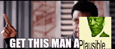 A Man With A Green Face And The Words Get This Man A Plausible Behind Him GIF