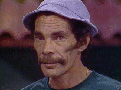A Man With A Hat And A Mustache Is Wearing A Green Shirt GIF