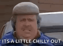 A Man With A Hat And Mustache Is Sitting In A Car And Saying `` It 'S A Little Chilly Out `` . GIF