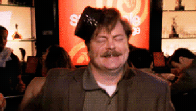 A Man With A Hat On His Head In Front Of A Sign That Says ' Sale ' GIF
