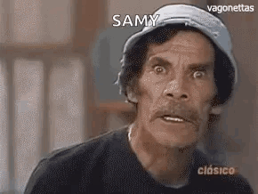 A Man With A Hat On Is Making A Funny Face . GIF