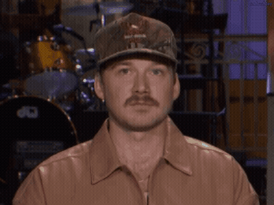 A Man With A Hat That Says Harley Davidson GIF