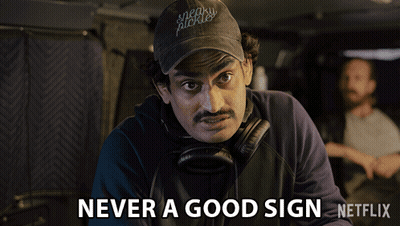 A Man With A Hat That Says Sneaky Pickles GIF