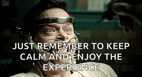 A Man With A Headband On His Head Is Being Injected With A Syringe And Says Just Remember To Keep Calm And Enjoy The Exp GIF
