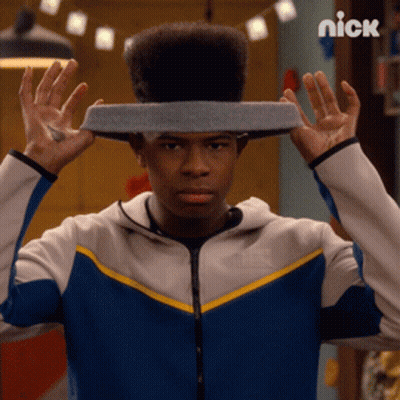 A Man With A Headband On His Head With The Nick Logo In The Background GIF
