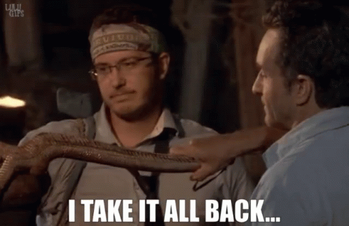 A Man With A Headband That Says Survivor Holds A Snake And Says " I Take It All Back " GIF