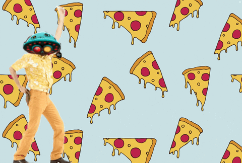 A Man With A Helmet On His Head Is Dancing In Front Of A Pattern Of Pizza Slices GIF