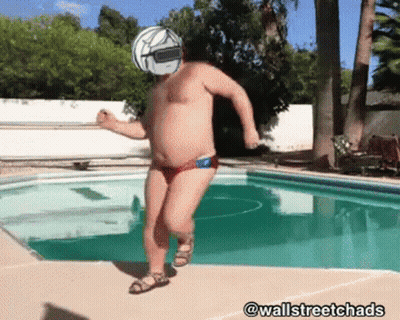 A Man With A Helmet On His Head Is Jumping Into A Pool GIF