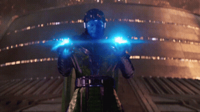 A Man With A Helmet On Is Holding A Blue Light In His Hands GIF