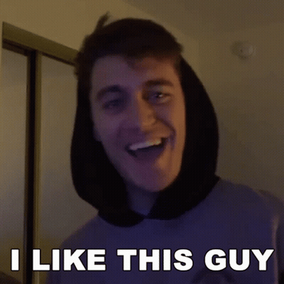A Man With A Hood On His Head Is Smiling And Says I Like This Guy GIF