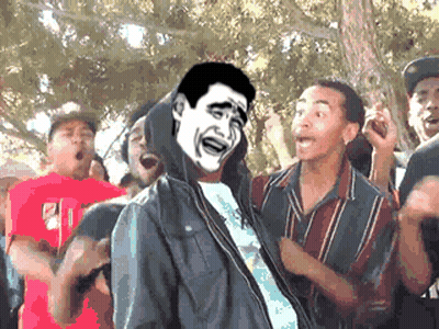 A Man With A Hoodie On Is Surrounded By A Group Of People GIF