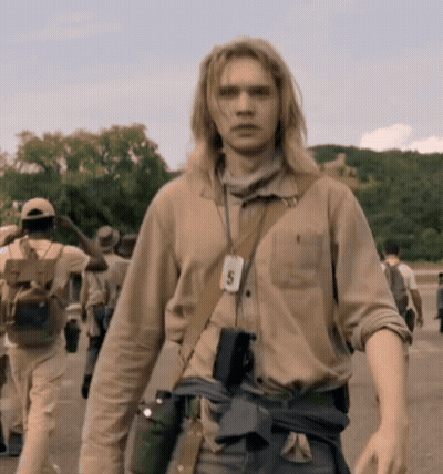 A Man With A Lanyard Around His Neck With The Number 5 GIF