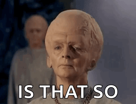 A Man With A Large Head Is Standing In Front Of A Group Of People . GIF