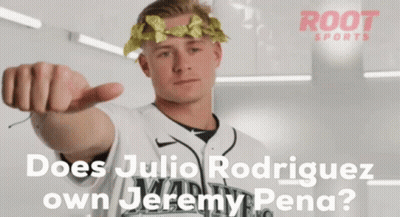 A Man With A Laurel Wreath On His Head Pointing At The Camera GIF