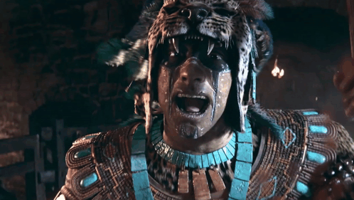 A Man With A Leopard Mask On His Face Screams GIF