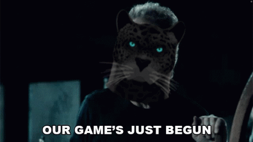 A Man With A Leopard 'S Head Is Holding A Guitar And Says `` Our Game 'S Just Begun '' . GIF