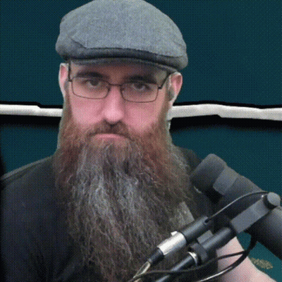 A Man With A Long Beard Wearing Glasses And A Hat GIF