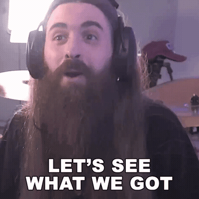 A Man With A Long Beard Wearing Headphones Says Let 'S See What We Got GIF