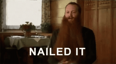 A Man With A Long Red Beard Is Sitting At A Table In A Restaurant And Says `` Nailed It '' . GIF