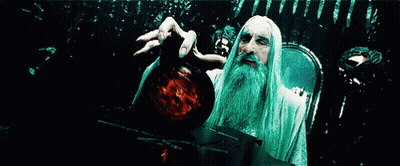 A Man With A Long White Beard Is Holding A Globe In His Hand GIF