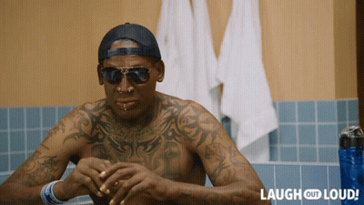 A Man With A Lot Of Tattoos Is Sitting In A Bathtub With Laugh Out Loud Written On The Bottom GIF