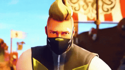 A Man With A Mask On His Face Is Looking At The Camera GIF