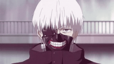 A Man With A Mask On His Face Is Smiling . GIF