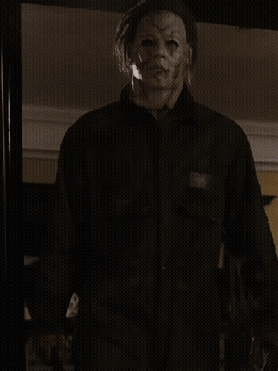 A Man With A Mask On His Face Is Wearing A Shirt And Tie GIF