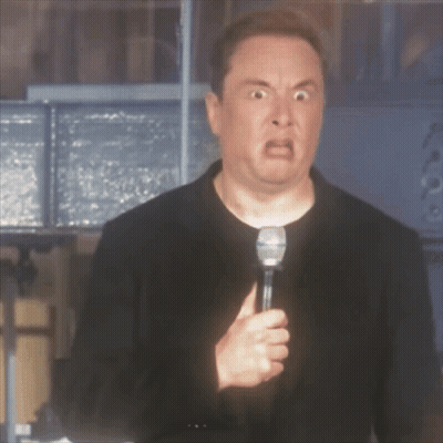 A Man With A Microphone Making A Funny Face GIF