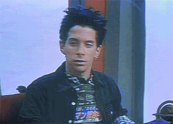A Man With A Mohawk Is Wearing A T-Shirt That Says ' I Am Age ' On It GIF