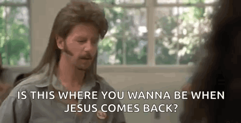 A Man With A Mullet And A Beard Is Talking To A Woman In Front Of A Window . GIF