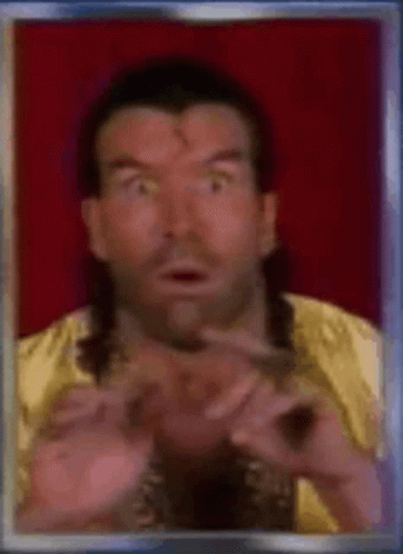 A Man With A Mullet And A Gold Shirt Is Making A Funny Face . GIF