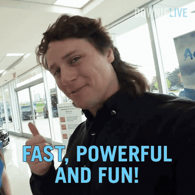 A Man With A Mullet Is Giving A Thumbs Up With The Words Fast Powerful And Fun Below Him GIF