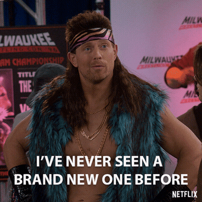 A Man With A Mullet Is Standing In Front Of A Sign That Says Milwaukee GIF
