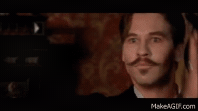 A Man With A Mustache And Beard Is Wearing A Red Shirt And A Red Shirt . GIF