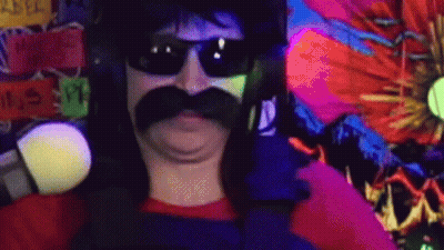 A Man With A Mustache And Sunglasses Is Standing In Front Of A Colorful Wall . GIF