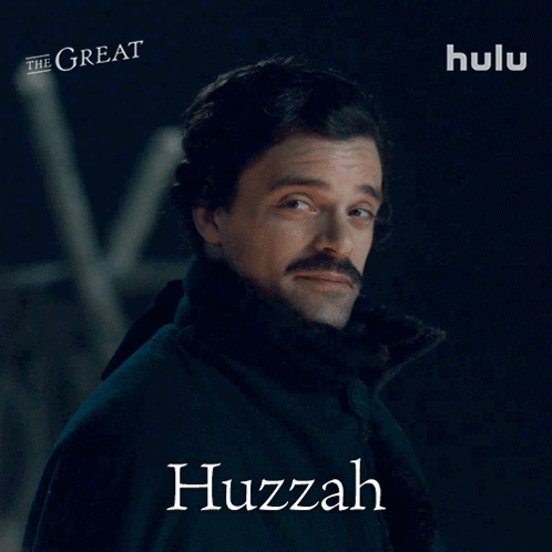 A Man With A Mustache And The Name Huzzah On His Face GIF