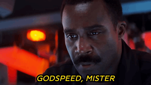 A Man With A Mustache And The Words Godspeed Mister Behind Him GIF
