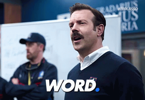A Man With A Mustache Has The Word Word Written On His Shirt GIF