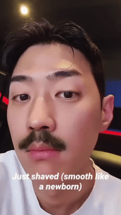 A Man With A Mustache Has The Words Just Shaved Smooth Like A Newborn On His Face GIF