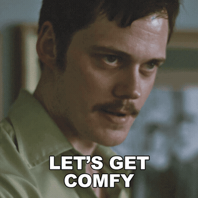 A Man With A Mustache Has The Words Let 'S Get Comfy Below His Face GIF